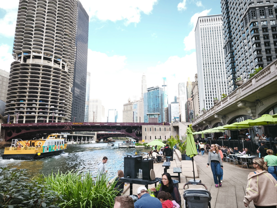 Chicago River winding between tall buildings