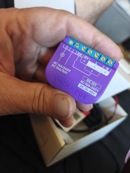 Switchbot relay switch garage door opener. It's a tiny little thing.